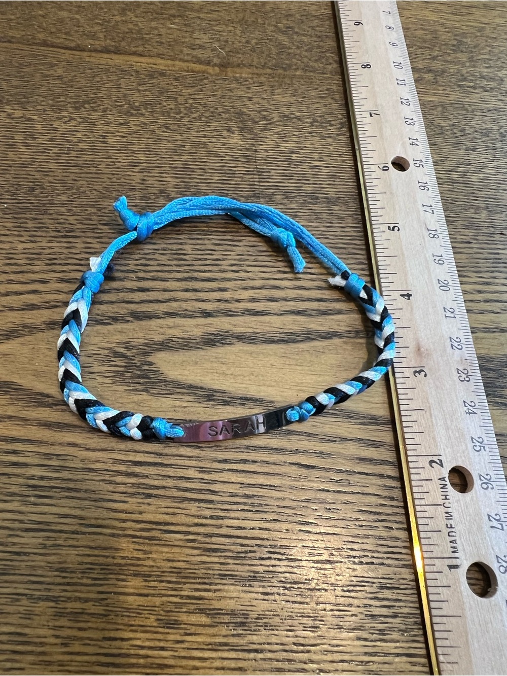 Custom Adjustable thread bracelet with “Sarah” name plate